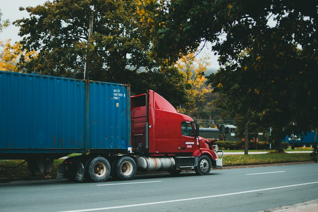 Crafting Captivating Headlines: Your awesome post title goes here a-red-semi-truck-driving-down-a-street-2ge743btfds